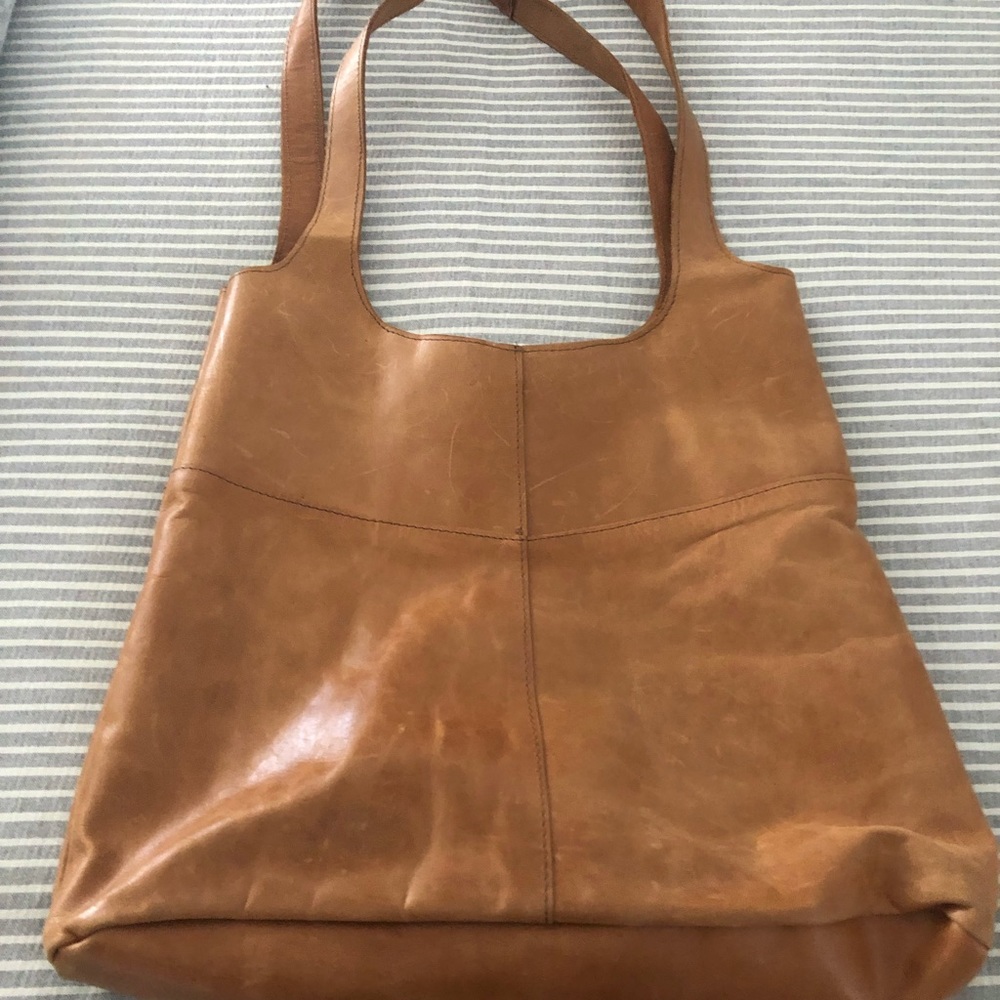 All genuine leather tote bag ! Beautiful color and has a distressed look !! 🥰